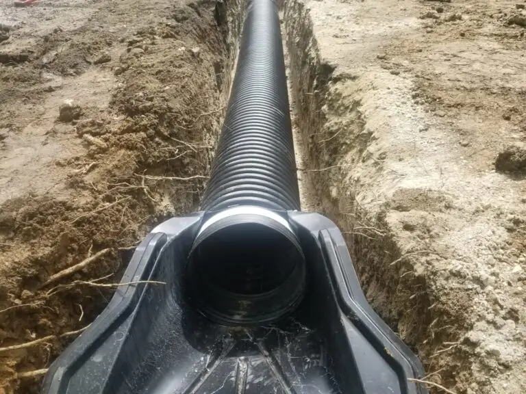 Septic tank being set into an excavated pit