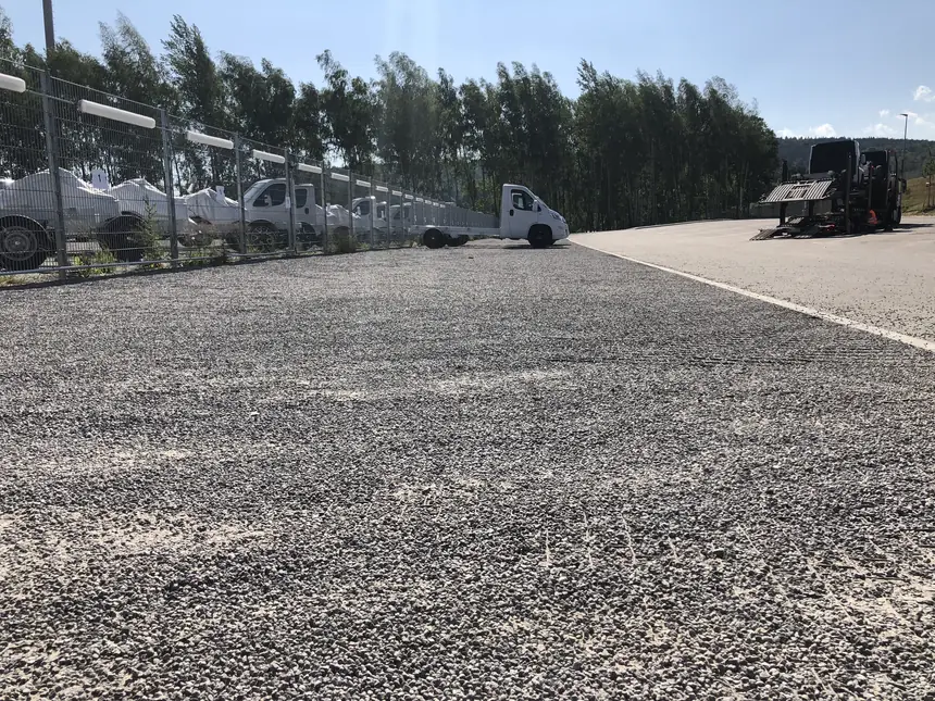 Gravel lot graded and compacted