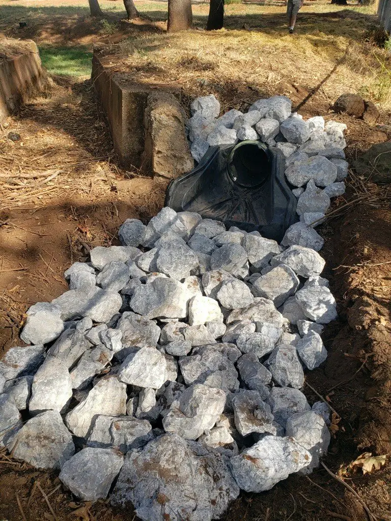 Outfall armoured with rip-rap